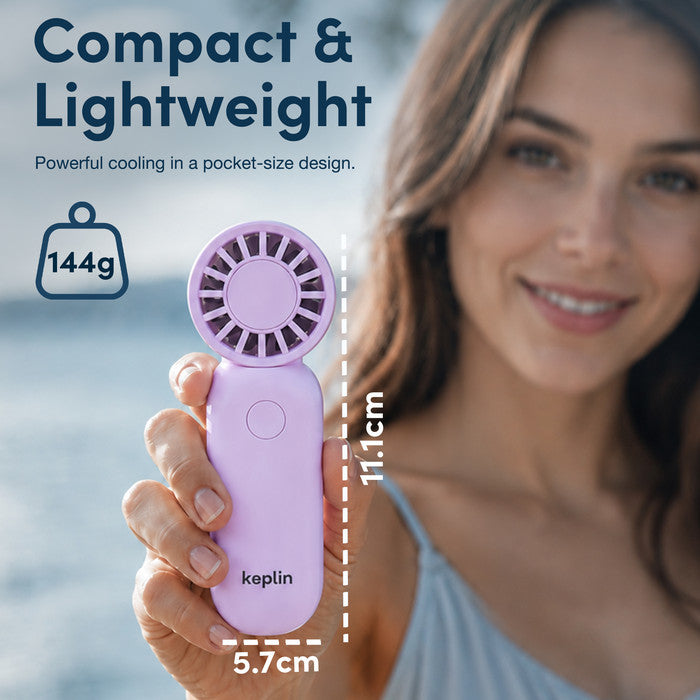 Woman holding KEPLIN compact handheld fan showing 11.1cm pocket size and 144g lightweight design