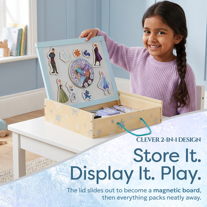 Girl lifting Frozen magnetic board lid from wooden storage box - magnetic activity board for kids
