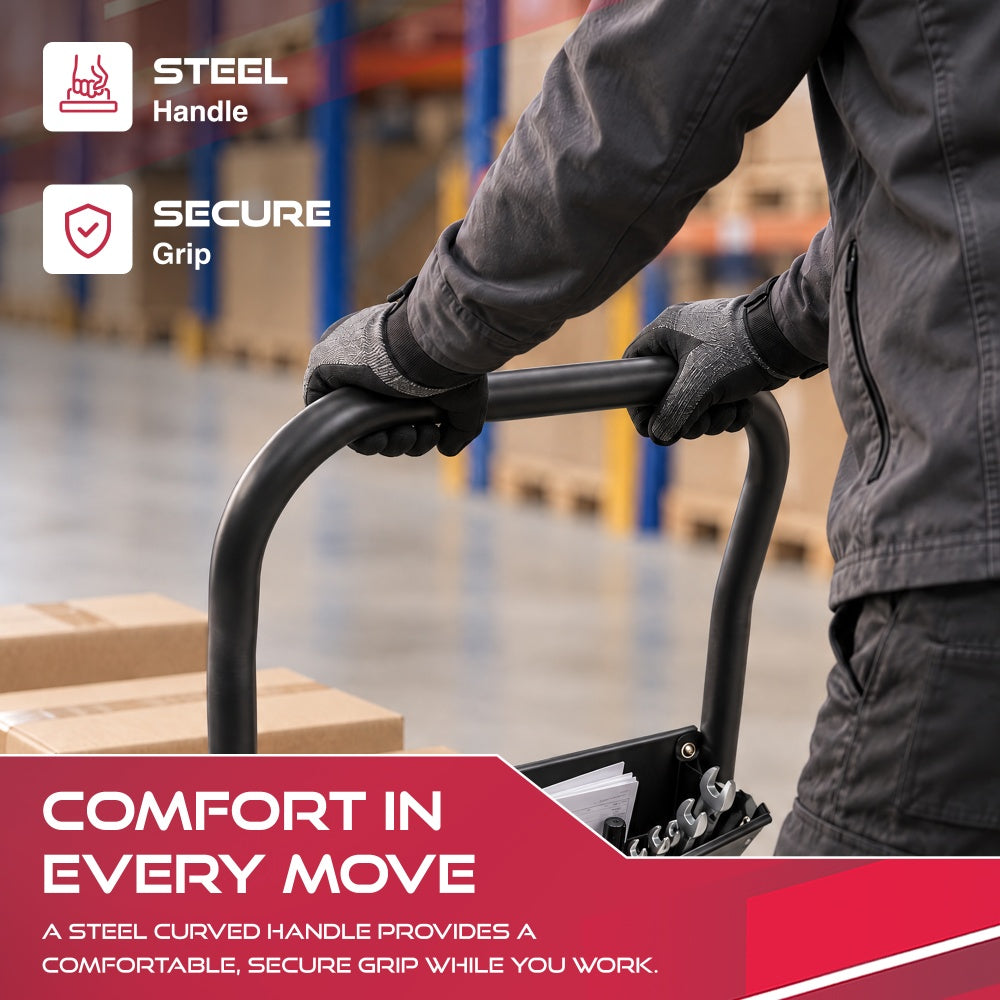 Gloved hands gripping the curved steel handle of the Haltons platform trolley with a tool pouch below