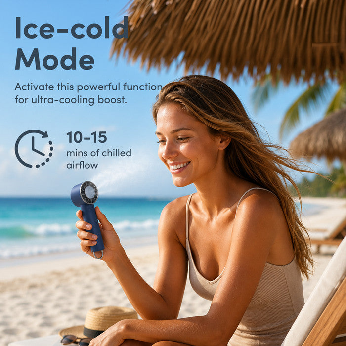 Woman using midnight blue handheld fan at beach – ice-cold mode, 10–15 mins chilled airflow