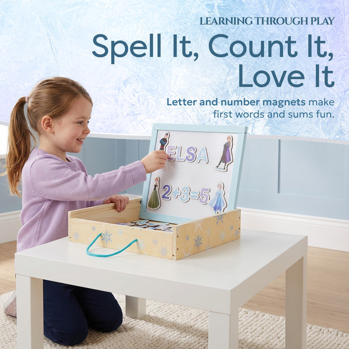 Girl spelling ELSA with Frozen letter and number magnets - magnetic letters and numbers for kids