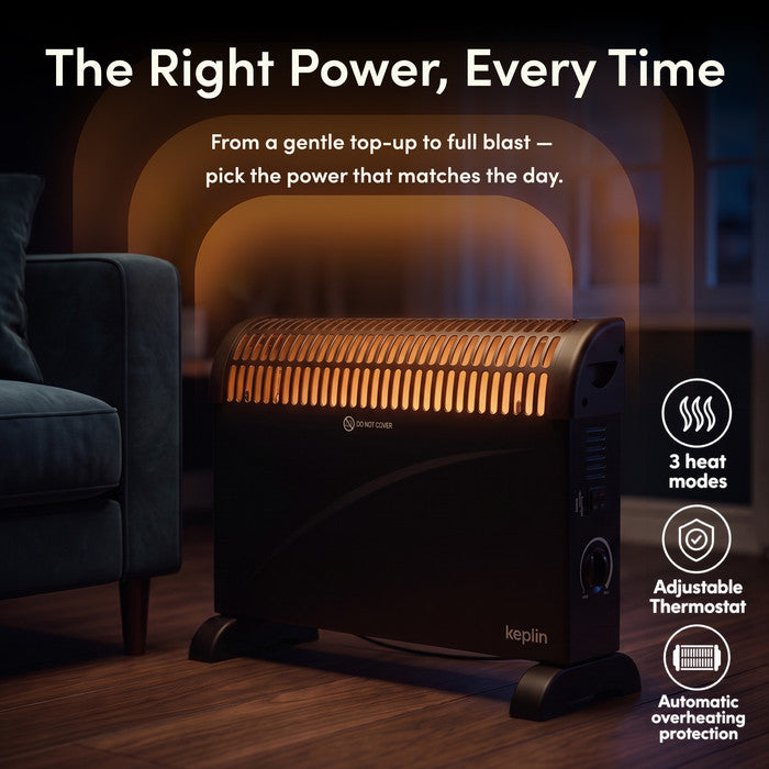 Black convector heater glowing on in living room with 3 heat modes, adjustable thermostat and overheat protection icons
