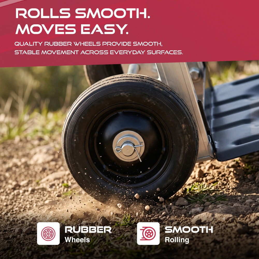 Black rubber wheel of the Haltons folding hand truck rolling over gravel and soil