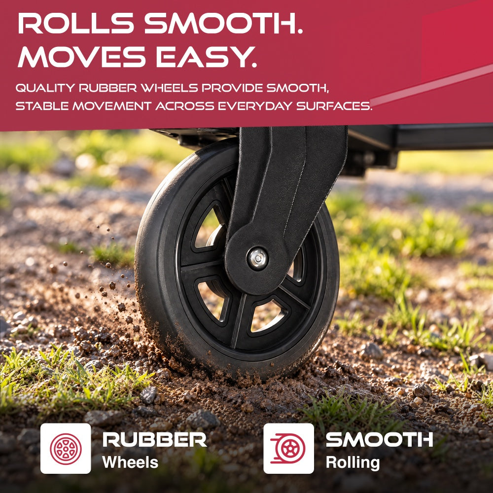 Black rubber wheel of the Haltons folding sack truck rolling over grass and soil