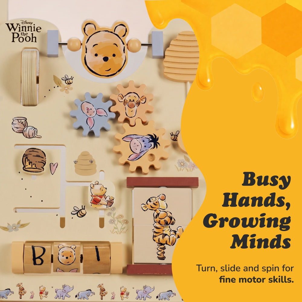 Close-up of the Winnie the Pooh wooden walker panel with Pooh bead slider and Piglet and Tigger and Eeyore gears