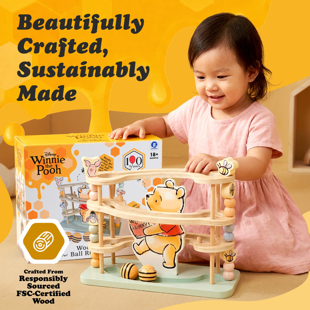 Baby wooden ball run toy featuring Pooh Bear characters — side view