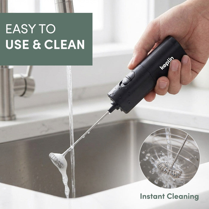 Slim milk frother being rinsed under running tap water for easy self-cleaning
