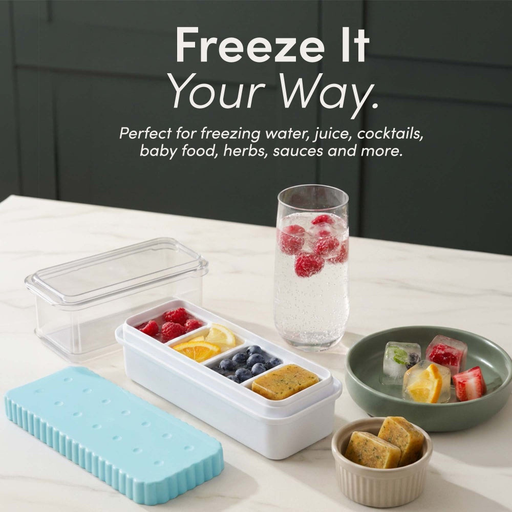 Ice tray compartments filled with raspberries and orange and blueberries and herb portions beside a glass of berry water