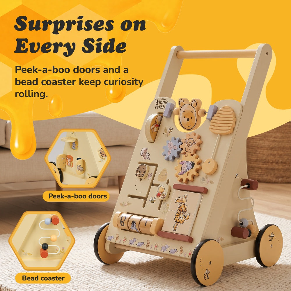 Winnie the Pooh wooden baby walker with peek-a-boo doors on the side and a bead coaster