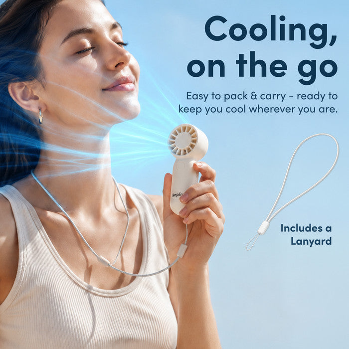 Woman cooling face with KEPLIN mini personal fan on neck lanyard strap – portable fan for summer