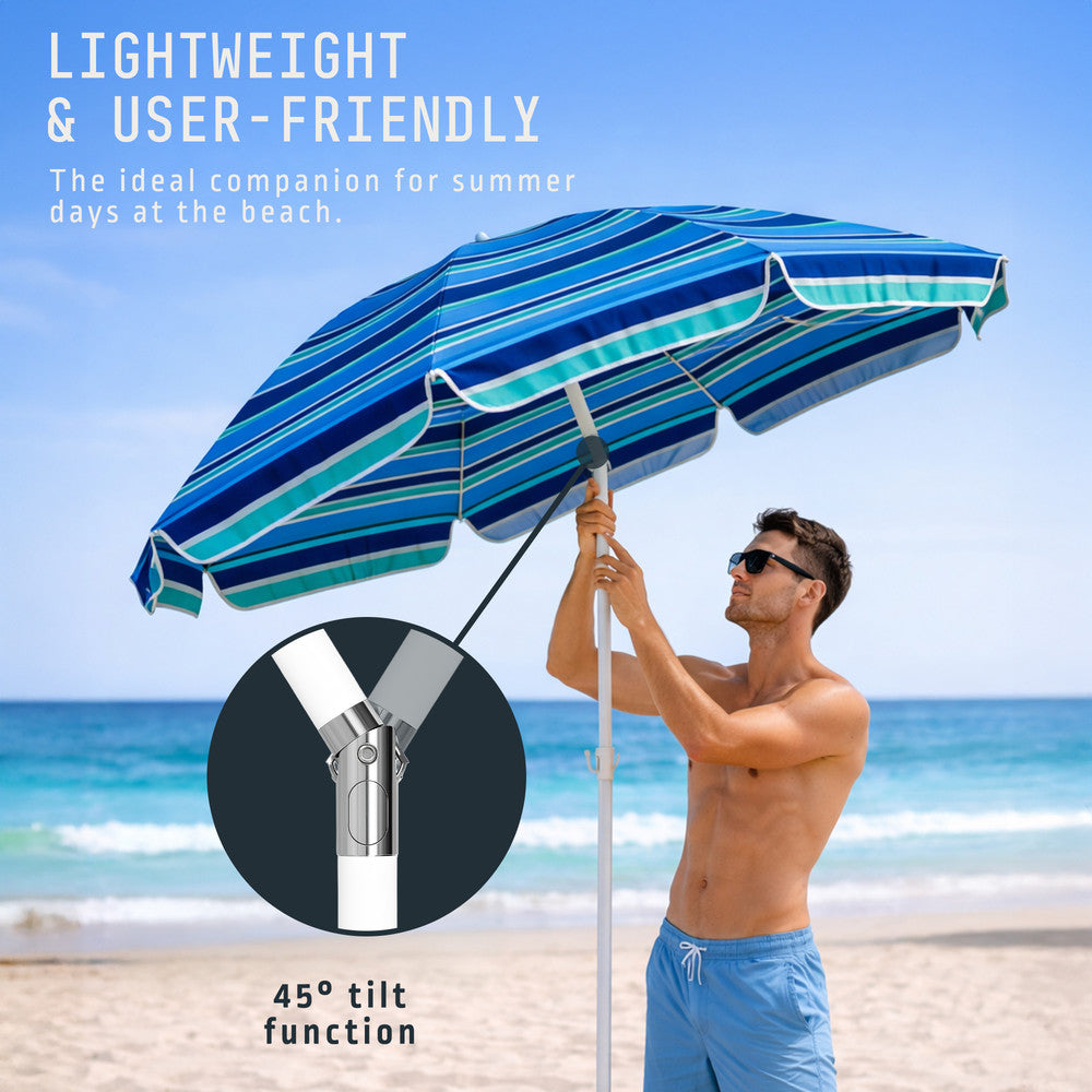 Voyager 2m tilting beach umbrella in use on sandy beach – blue stripe portable sun parasol with bag, UK