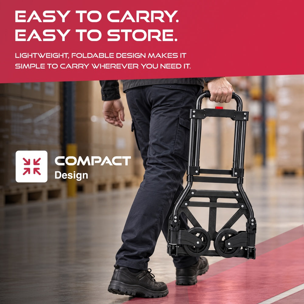 Man carrying the folded Haltons hand truck by its handle through a warehouse