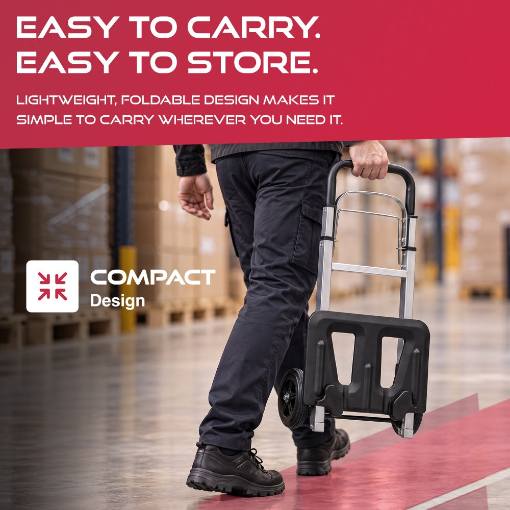 Man carrying the folded Haltons hand truck by the handle through a warehouse