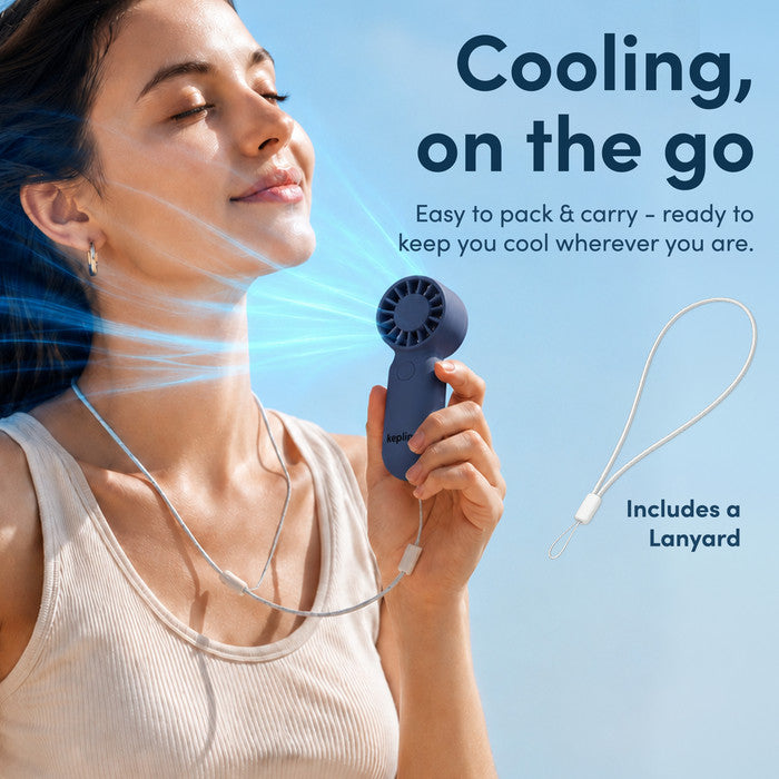 Woman cooling face with KEPLIN mini personal fan on neck lanyard strap – portable fan for summer