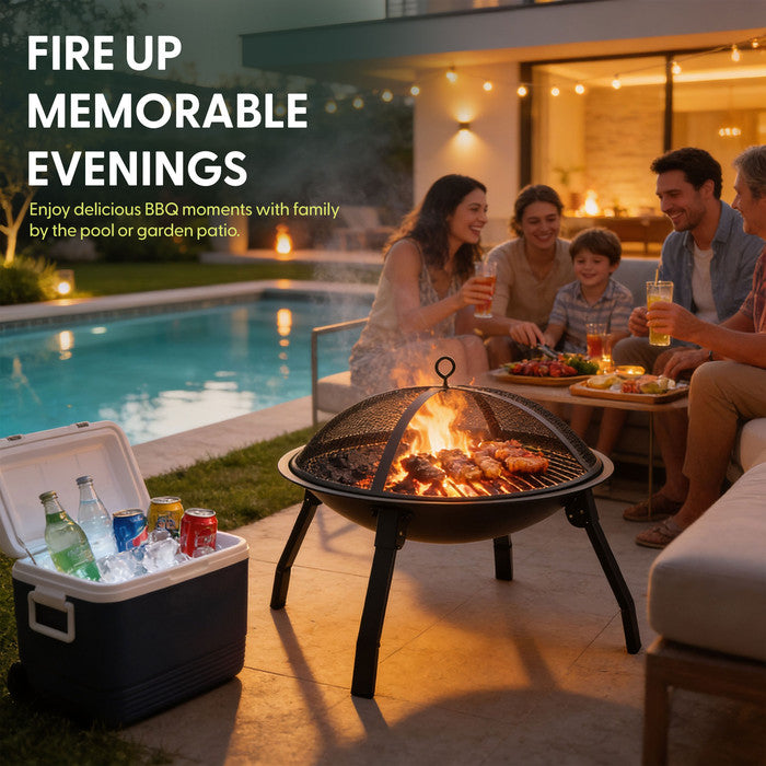 Portable BBQ fire pit on grass at campsite with food grilling