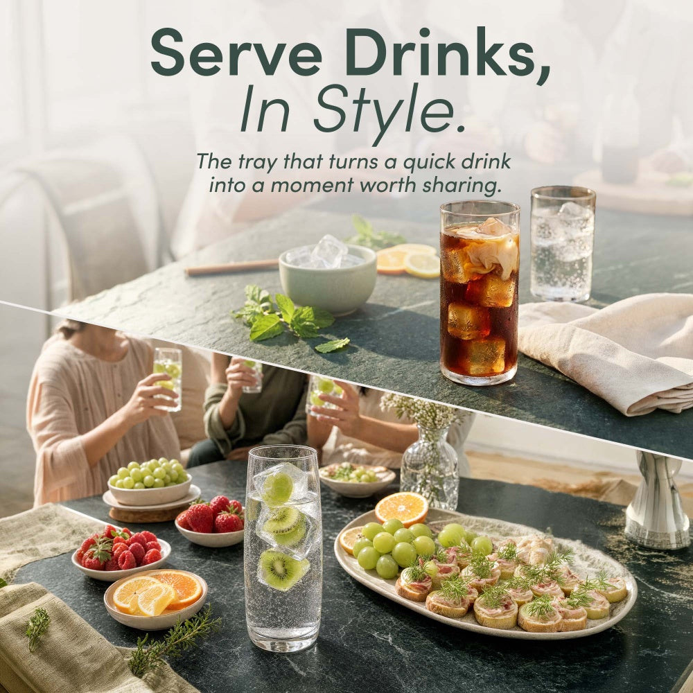 Large ice cubes with kiwi slices and grapes in glasses of sparkling water on a serving table