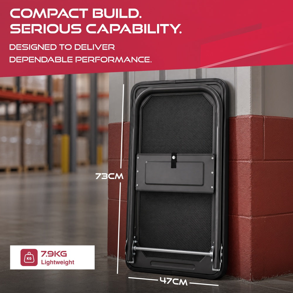 Haltons platform trolley folded flat against a wall showing 73cm by 47cm size and weighing 7.9kg