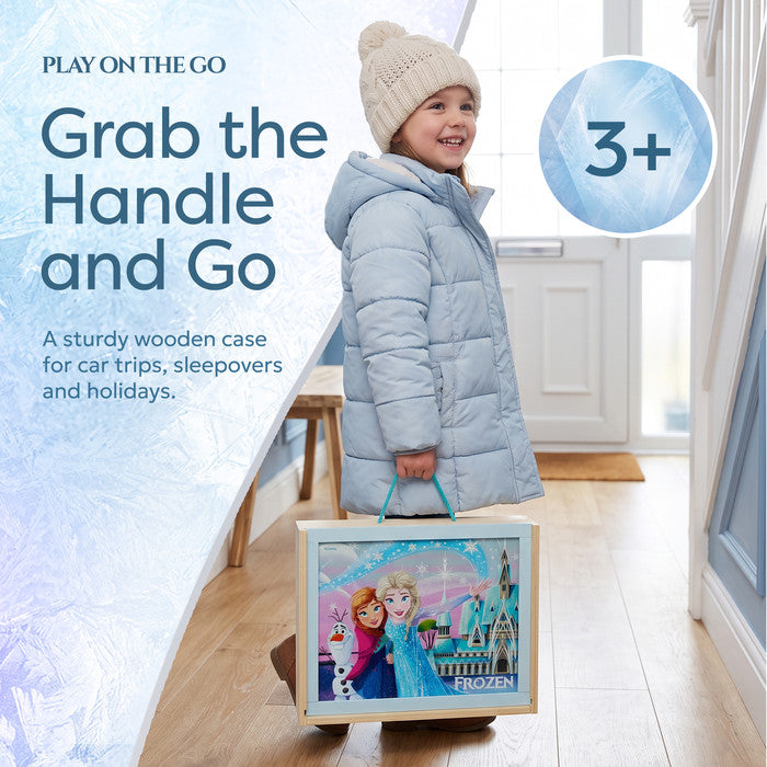 Girl carrying Frozen wooden activity case by the handle, ages 3+ - travel activities for kids