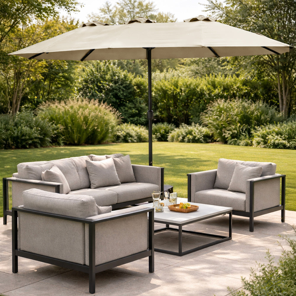 Cream double garden parasol providing shade beside a swimming pool with sun loungers