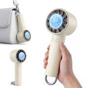 Cream portable handheld fan with cooling plate held in hand