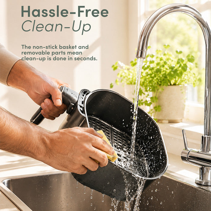 Non-stick removable air fryer basket being rinsed under tap – easy dishwasher safe clean