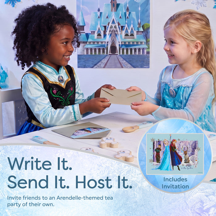 Two children playing with Disney Frozen Elsa roleplay set and party invitations 